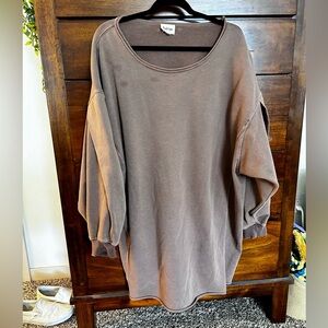 This is a good brown sweater dress. There are 3 removable stains on the front.